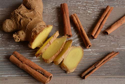 sliced ginger and cinnamon stick